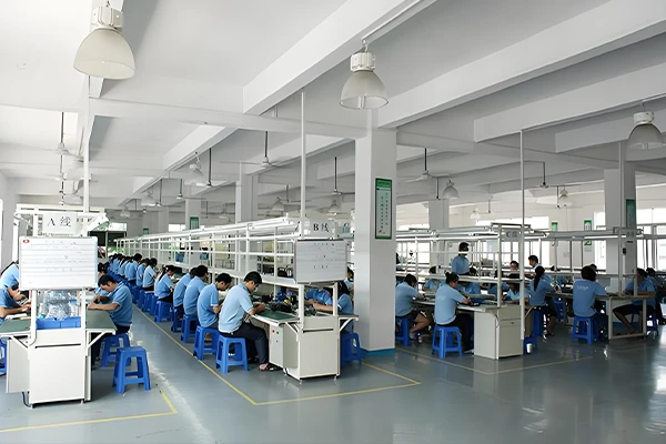 Technicians assembling aesthetic equipment in the workshop