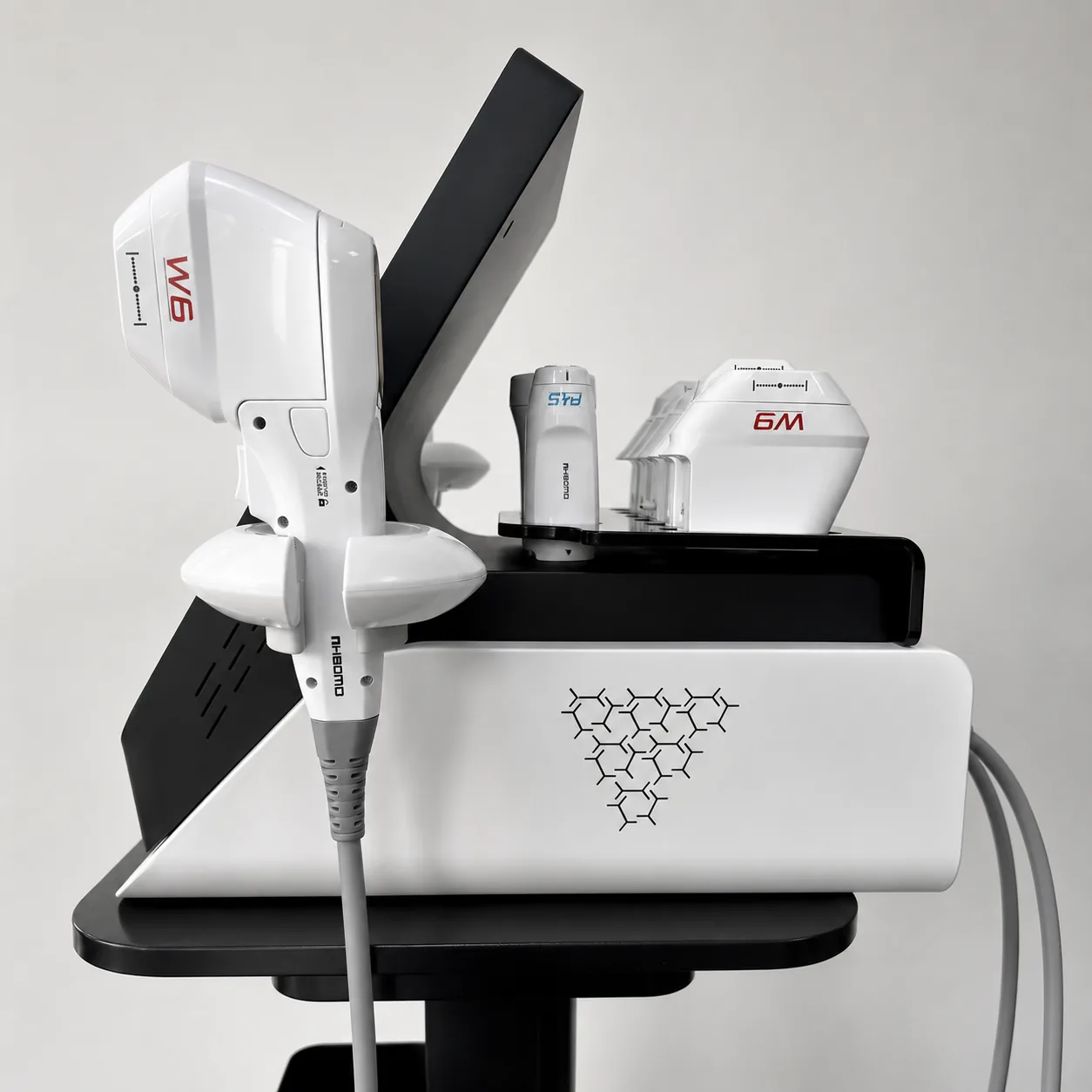 Left-side view of the V-Max HIFU machine with handpiece and cartridge holders