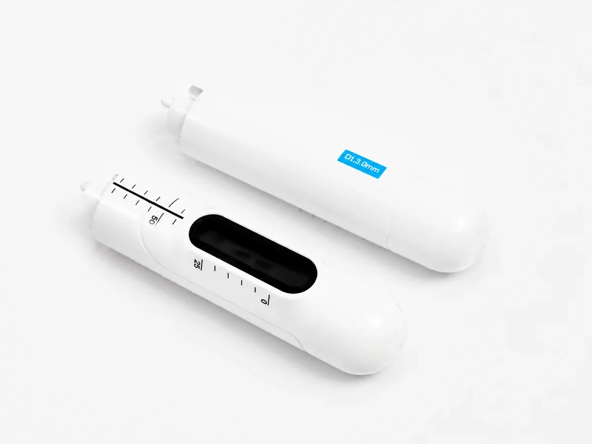 Two white HIFU vaginal cartridge components with visible depth markings
